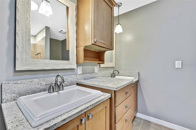 bathroom with tile patterned floors and vanity