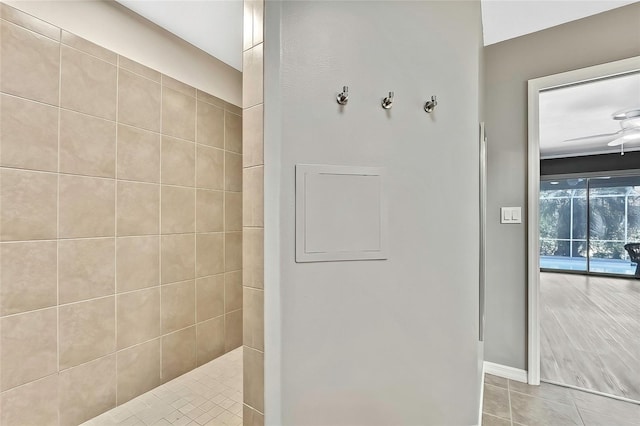 bathroom with ceiling fan, tile patterned floors, and tiled shower