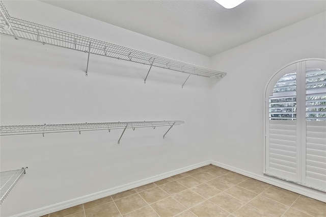 walk in closet featuring light tile patterned floors