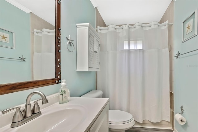 full bathroom with toilet, shower / tub combo, hardwood / wood-style flooring, and vanity