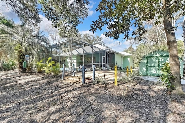 back of property with a lanai