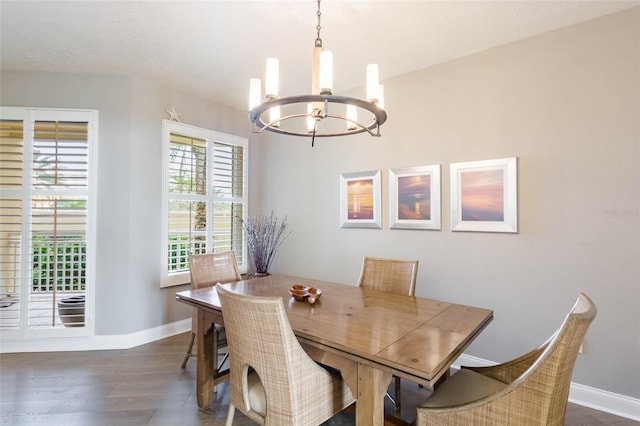 dining room featuring a chandelier and dark hardwood / wood-style floors