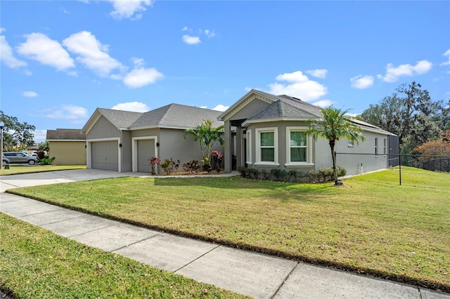 ranch-style home with a front lawn and a garage