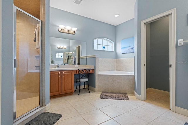 bathroom with vanity, tile patterned floors, and shower with separate bathtub