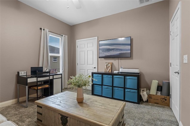 office area with carpet floors and ceiling fan