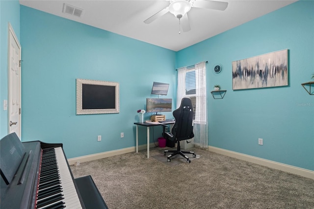 carpeted home office with ceiling fan