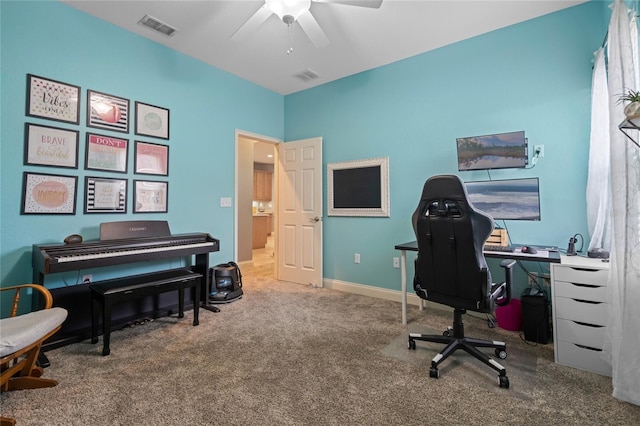 carpeted office with ceiling fan