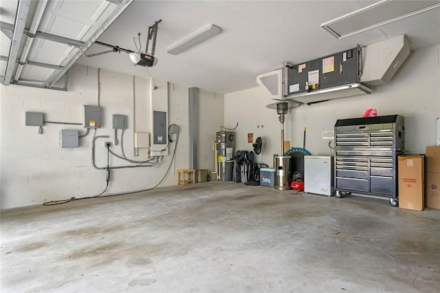 garage with electric panel, refrigerator, secured water heater, and a garage door opener