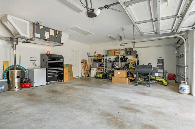 garage featuring a garage door opener and fridge