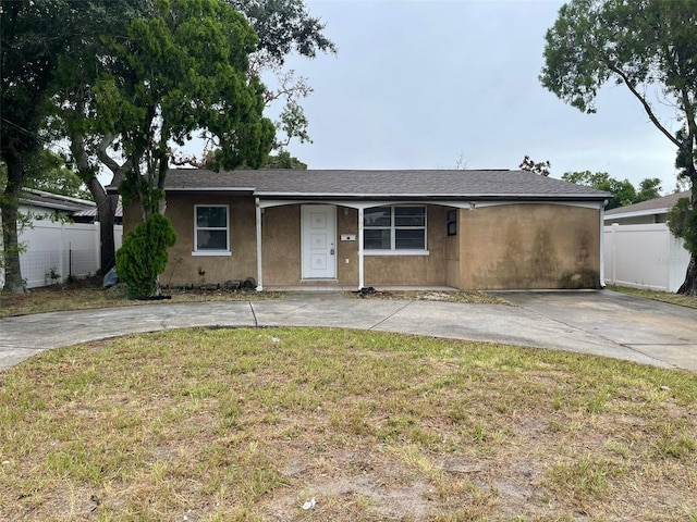 ranch-style home with a front yard