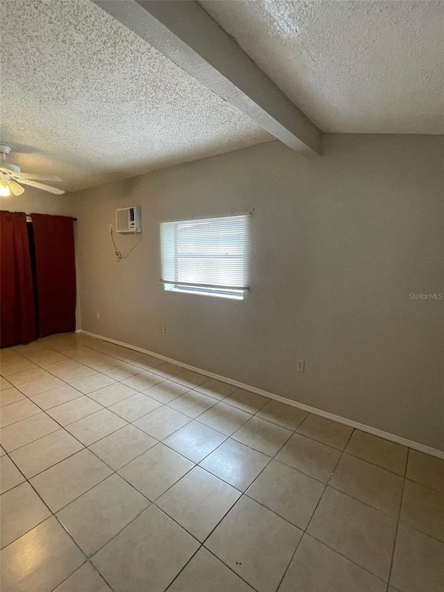 tiled spare room featuring a wall mounted air conditioner, beam ceiling, a textured ceiling, and ceiling fan