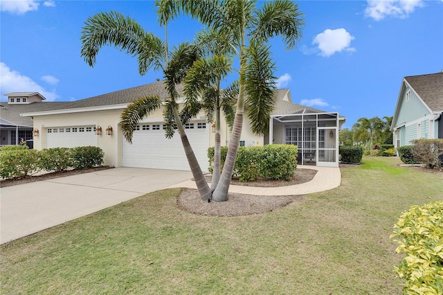 view of front of house featuring a garage, a front yard, and a lanai