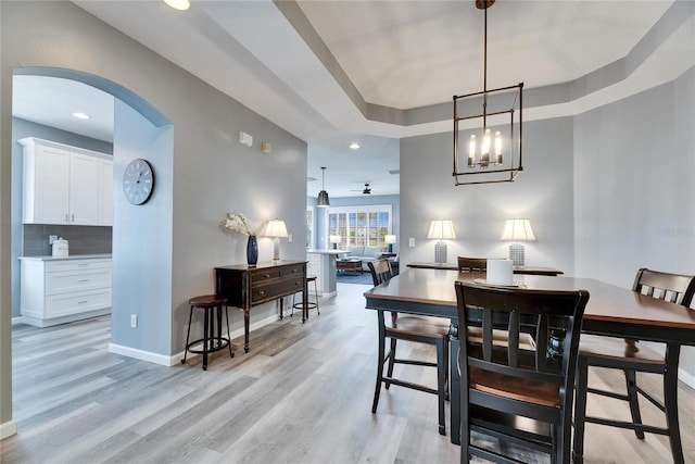 dining space featuring ceiling fan and light hardwood / wood-style flooring