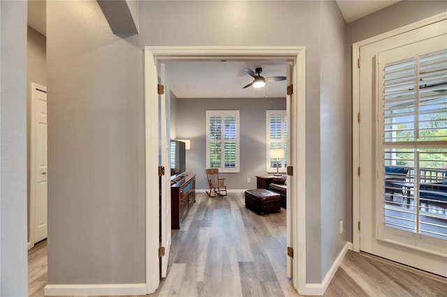 corridor with light wood-type flooring