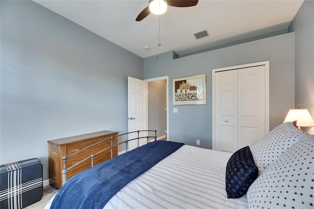 carpeted bedroom featuring a closet and ceiling fan