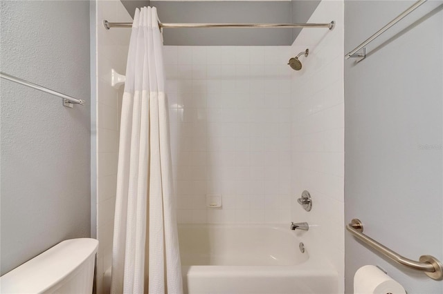 bathroom with toilet and shower / bathtub combination with curtain