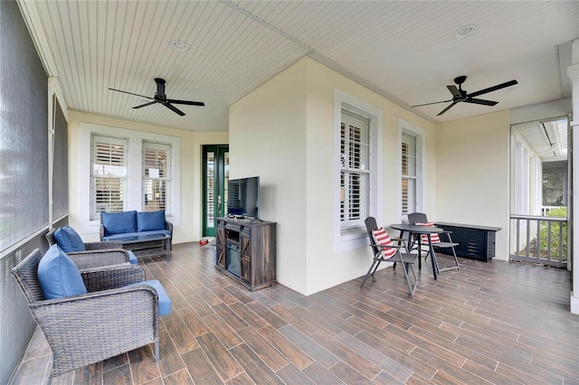 sunroom / solarium with ceiling fan and plenty of natural light