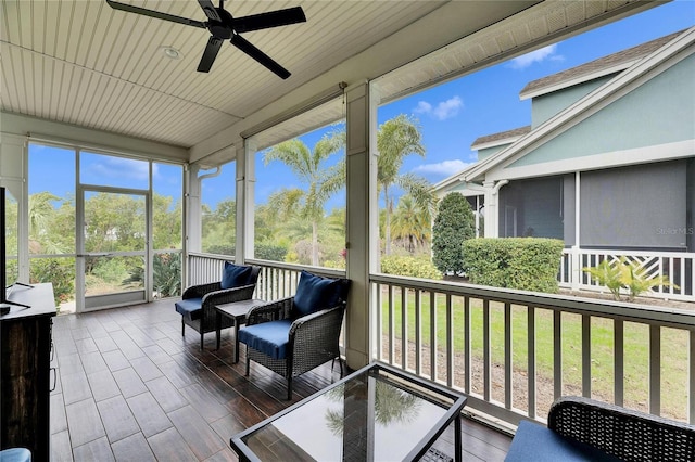 sunroom / solarium with ceiling fan