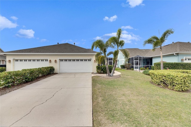 ranch-style house featuring a front yard and a garage