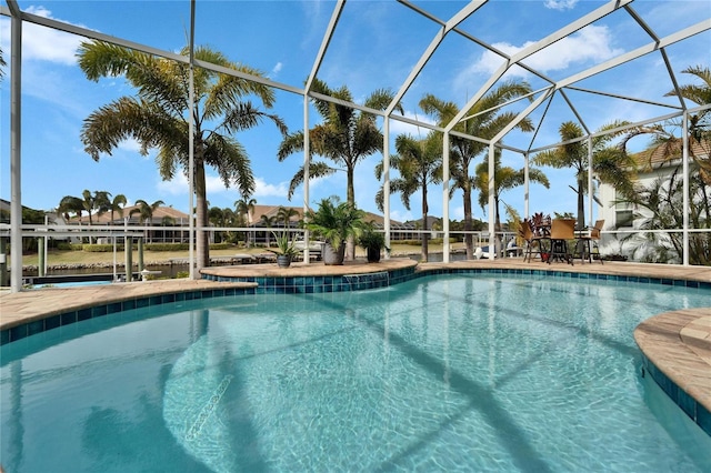 view of swimming pool with a lanai