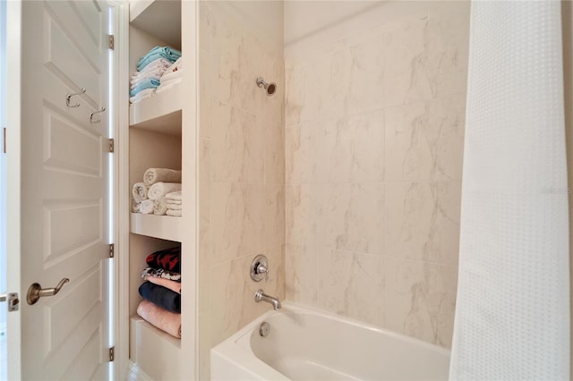 bathroom with shower / bathtub combination with curtain