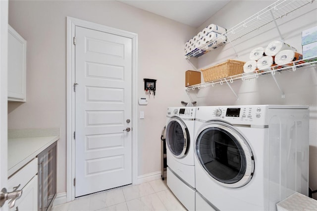 washroom featuring washer and dryer and wine cooler