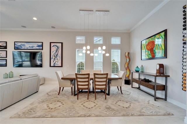 dining area with a chandelier and crown molding