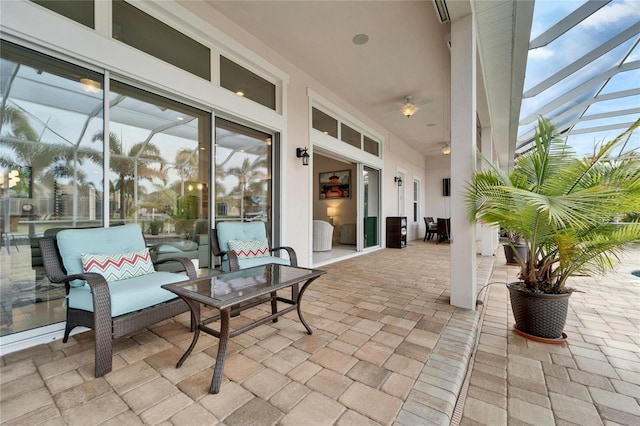 view of patio / terrace featuring a lanai and an outdoor living space