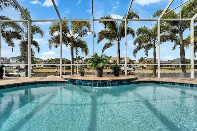 view of pool featuring glass enclosure