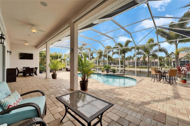 view of pool featuring a lanai and a patio