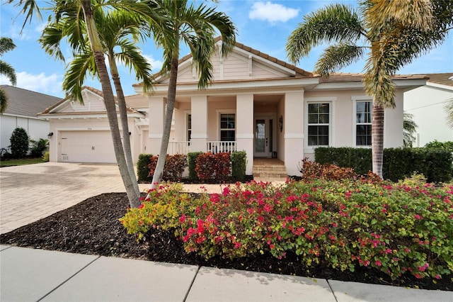 view of front of home with a garage and covered porch