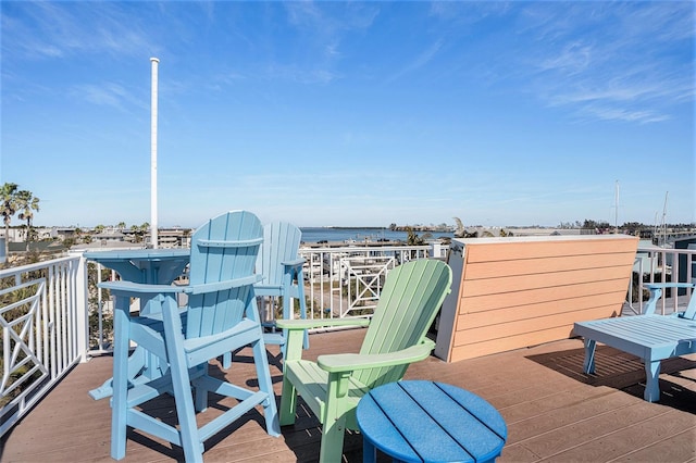 wooden deck featuring a water view