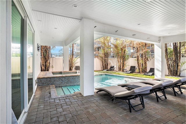 view of swimming pool featuring a patio area