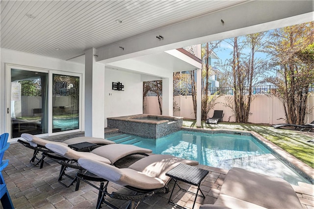 view of swimming pool featuring an in ground hot tub and a patio