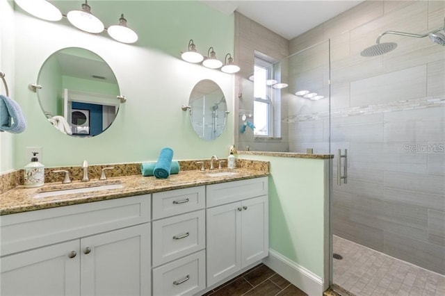 206 Church Ave, Bradenton Beach, FL 34217 - bathroom with double vanity, a sink, and a shower stall