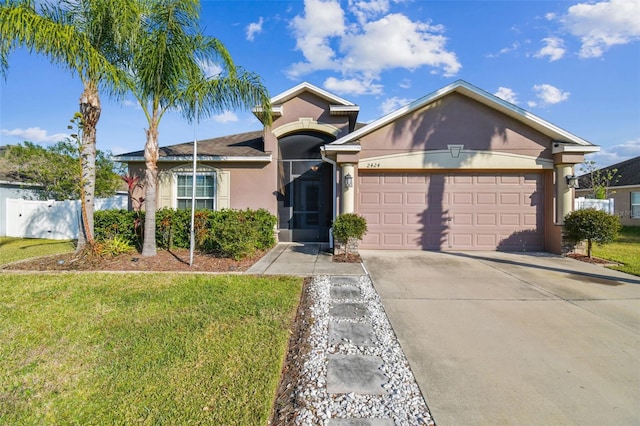 ranch-style home featuring a garage and a front lawn