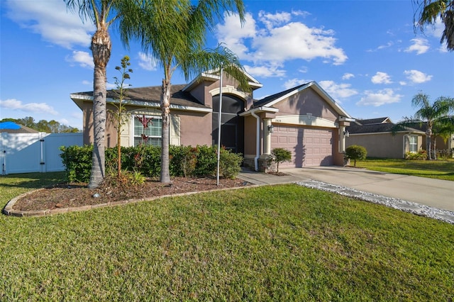 view of front facade with a front lawn and a garage