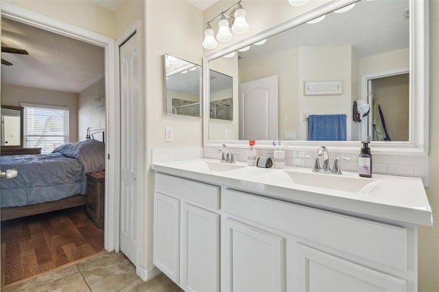 bathroom featuring vanity, tile patterned flooring, decorative backsplash, and ceiling fan