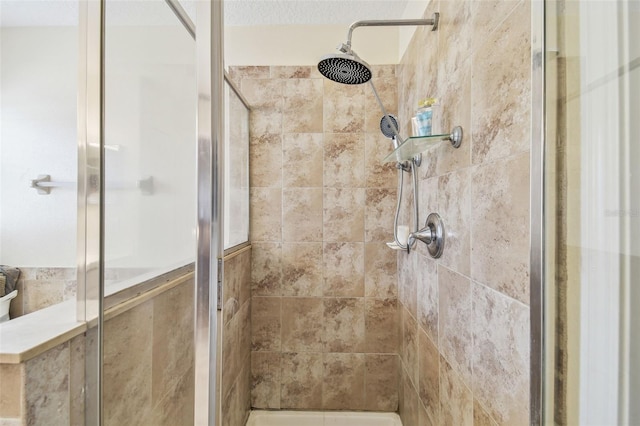 bathroom with a tile shower