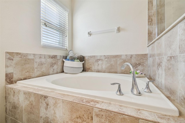 bathroom with a relaxing tiled tub