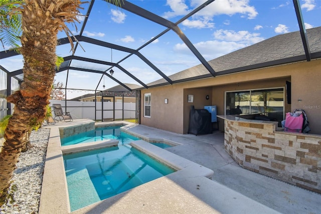 view of pool featuring a lanai, a bar, a patio area, and an in ground hot tub