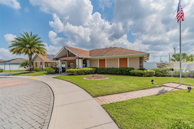 ranch-style house with a front yard