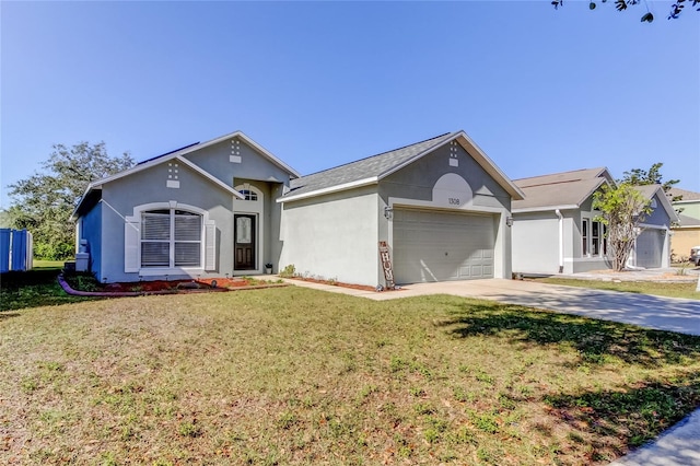 single story home with a garage and a front yard