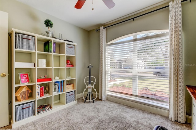 playroom featuring carpet and ceiling fan