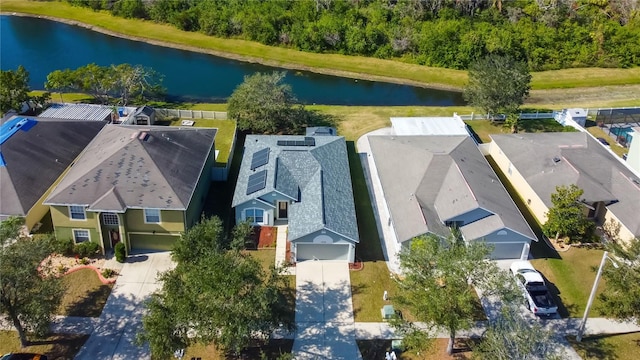 birds eye view of property with a water view