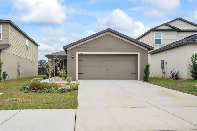 view of front of home with a garage and a front yard