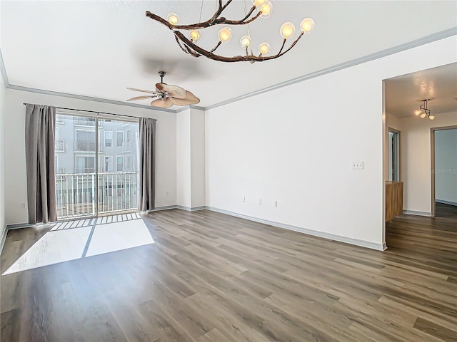 interior space featuring ceiling fan with notable chandelier, hardwood / wood-style floors, and ornamental molding