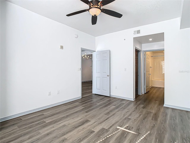 unfurnished bedroom featuring ceiling fan and dark hardwood / wood-style floors