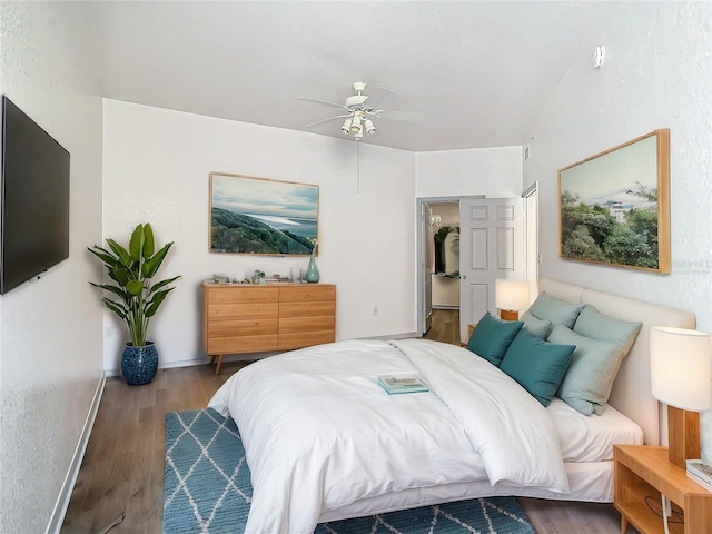 bedroom with hardwood / wood-style floors and ceiling fan