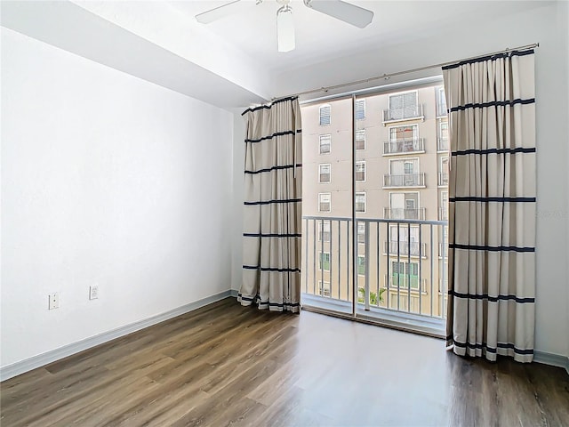 spare room featuring ceiling fan and hardwood / wood-style flooring